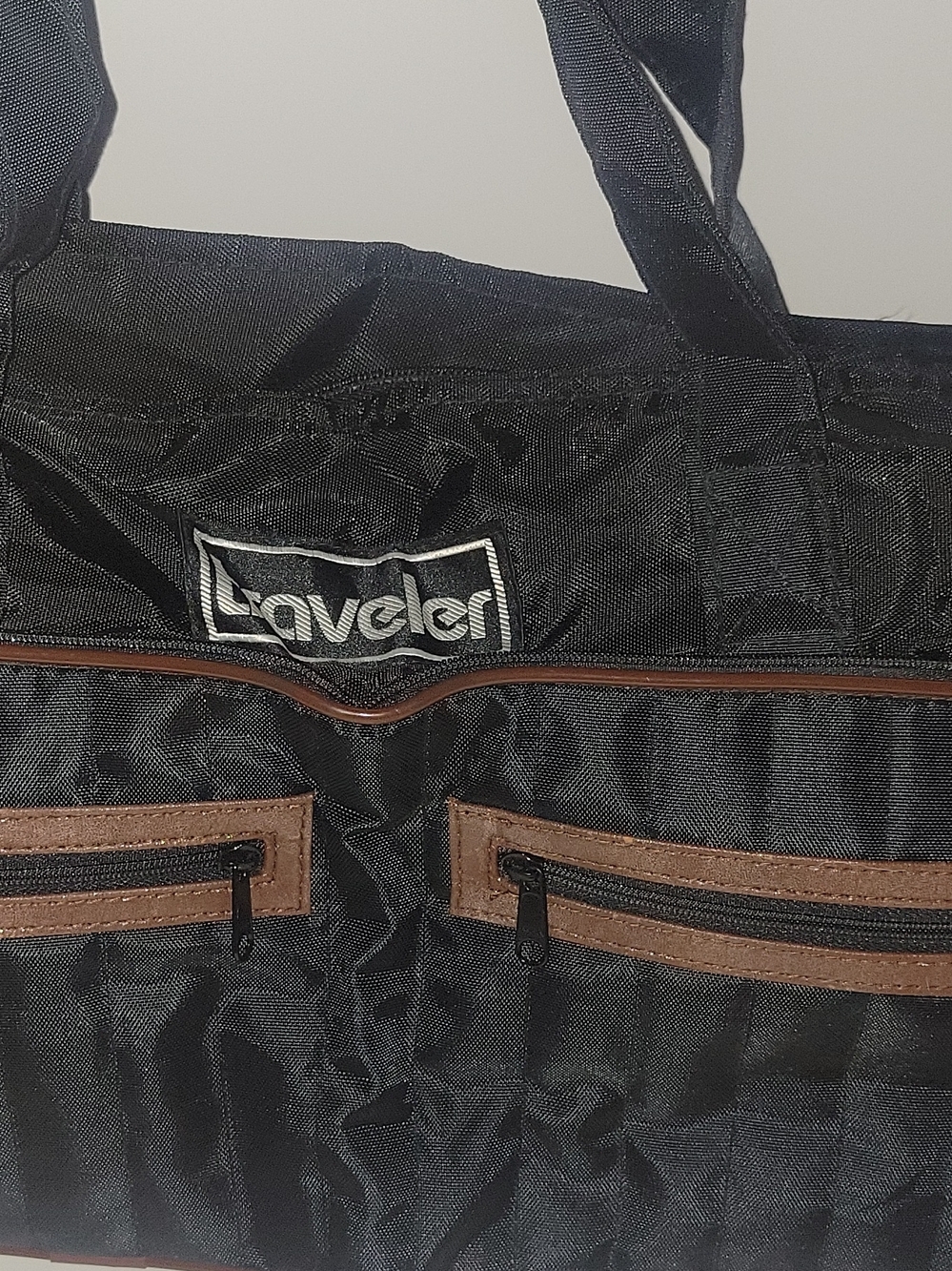 Traveler Foldable Black Duffel Bag with Brown Trim and Front Zip Pockets